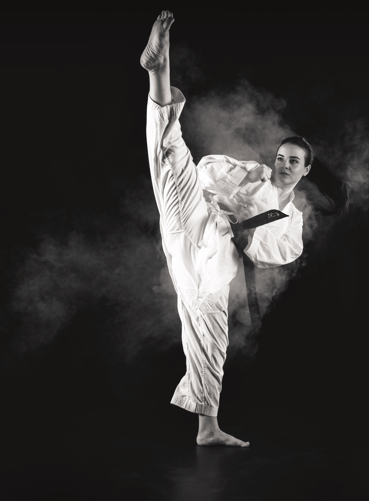 Deborah Baum performing a high karate kick